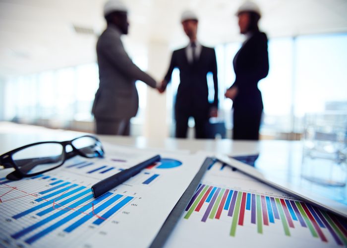 Business documents on background of three business partners